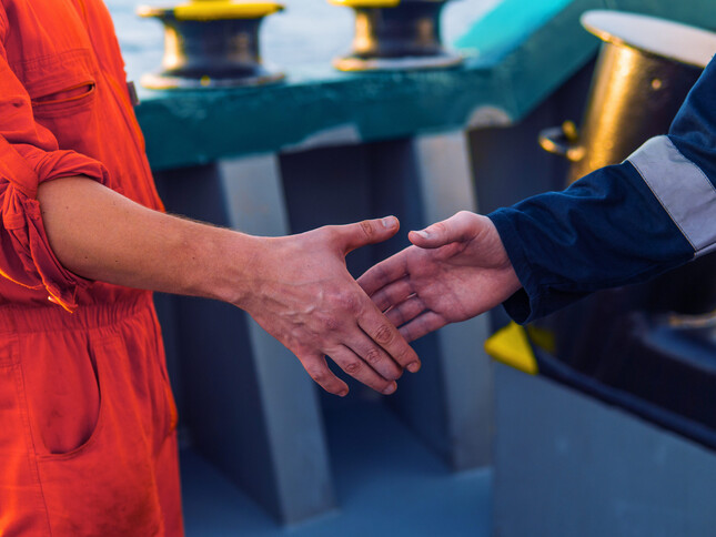 VP_marine-contractor-businessman-handshaking-with-worker